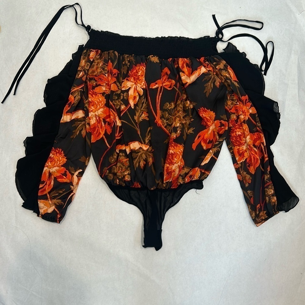 Free People Born To Love ruffle long sleeve Bodysuit NWOT black orange